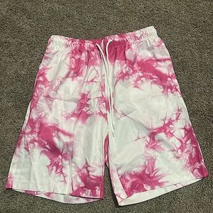 Tie-dye pink and white shorts/swimsuit.